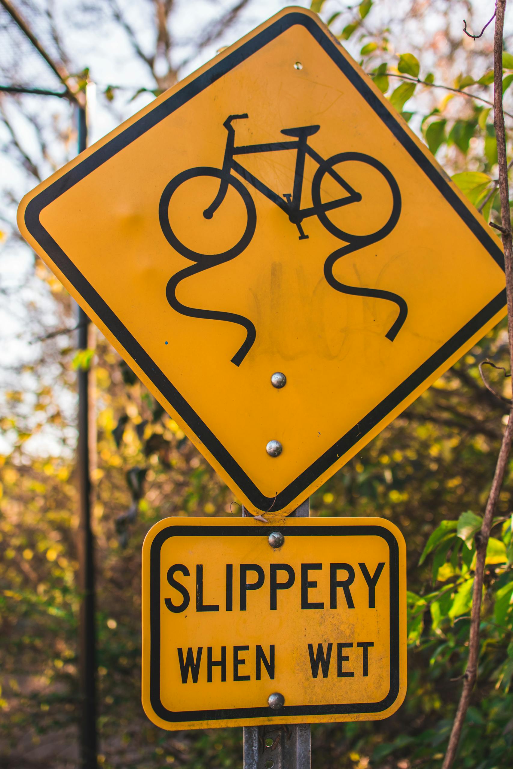 Traffic sign alerting cyclists to slippery conditions when wet.